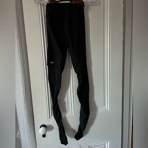 Black Alo leggings, high waisted and stretchy.